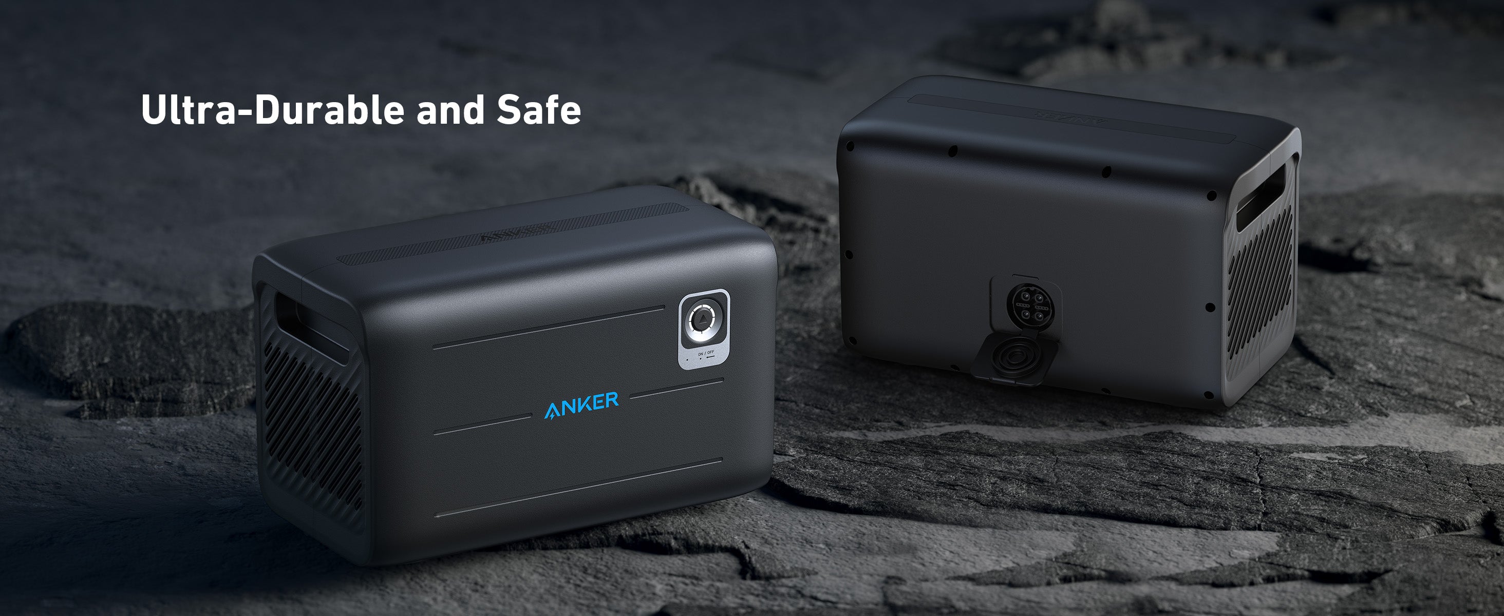 Anker SOLIX F2600 Portable Solar Generator with BP2600 Expansion Battery - 5120Wh Storage, 2400W Output, 200W Solar Panel Two black Anker SOLIX F2600 Portable Solar Generators with BP2600 Expansion Battery are displayed on rocky terrain, showing front and back. Ultra-Durable and Safe text highlights long-lasting LFP battery tech and 5120Wh storage with 2400W output.