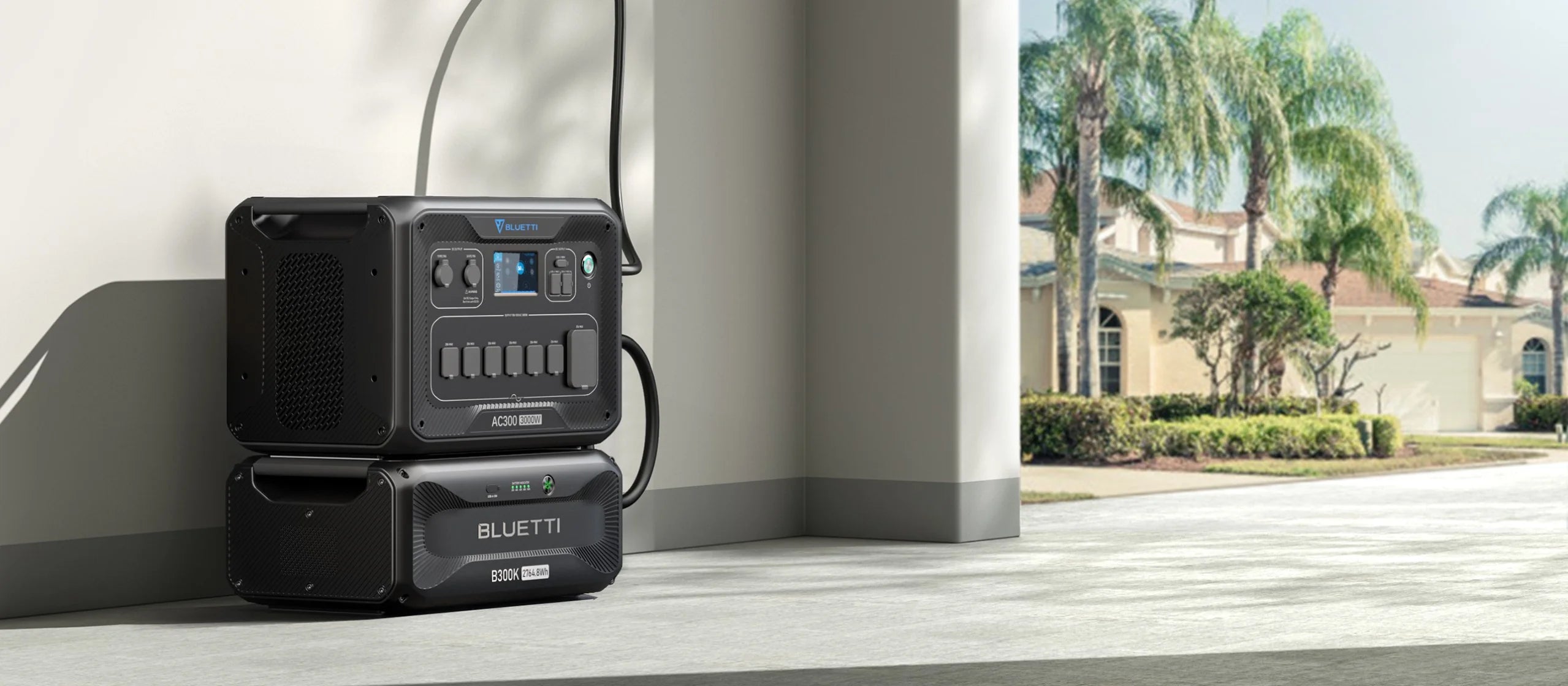 BLUETTI AC300+B300K 3,000W 2,764.8Wh Power Station | Home Battery Backup A Bluetti AC300+B300K 3,000W 2,764.8Wh Home Battery Backup is stacked and plugged in near a wall inside a modern home, sunlight streaming in and palm trees visible outside through a large open door.