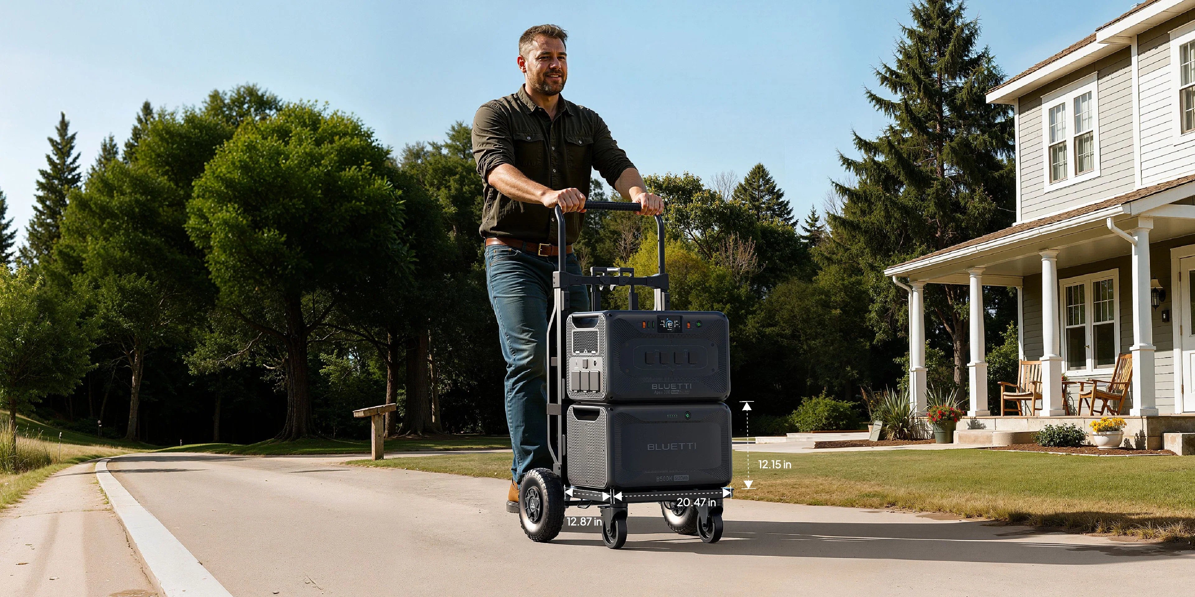 Bluetti B500K Expansion Battery 5,120Wh A man pushes a large Bluetti B500K Expansion Battery 5,120Wh portable power station on wheels down a suburban street, passing a white house with a porch and surrounded by green trees.
