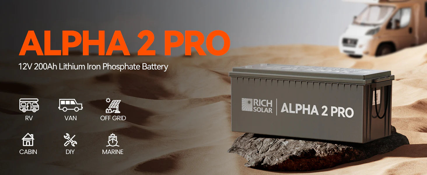 Rich Solar 12V 200Ah Lithium Battery | ALPHA 2 PRO A large gray Rich Solar 12V 200Ah Lithium Battery (ALPHA 2 PRO) sits on sand with an RV behind it. Ideal for RV, van, off-grid, cabin, DIY, and marine use, it offers powerful 200Ah capacity and 2560Wh energy storage.