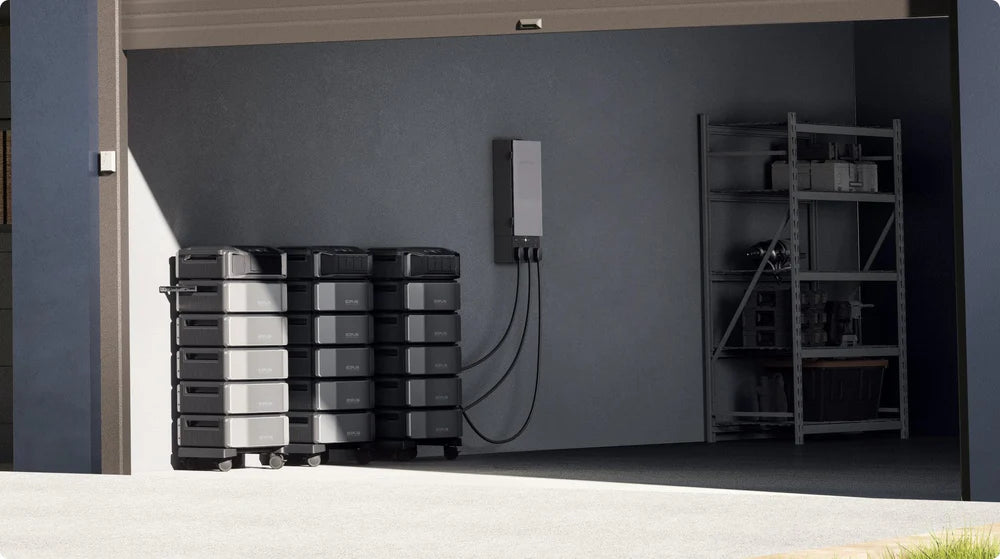 EcoFlow Delta Pro Ultra 7.2kW Portable Power Station A garage interior shows two stacks of Ecoflow Delta Pro Ultra 7.2kW Portable Power Stations with expandable capacity, connected to a wall-mounted energy management system beside metal shelves stocked for emergency preparedness.