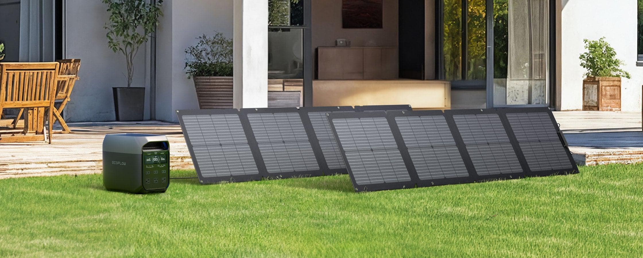 Three Ecoflow portable solar panels are set up on a grassy lawn outside a modern house, connected to the Ecoflow DELTA 3 1,800W 1,024Wh Portable Power Station with fast charging; patio furniture is visible in the background.